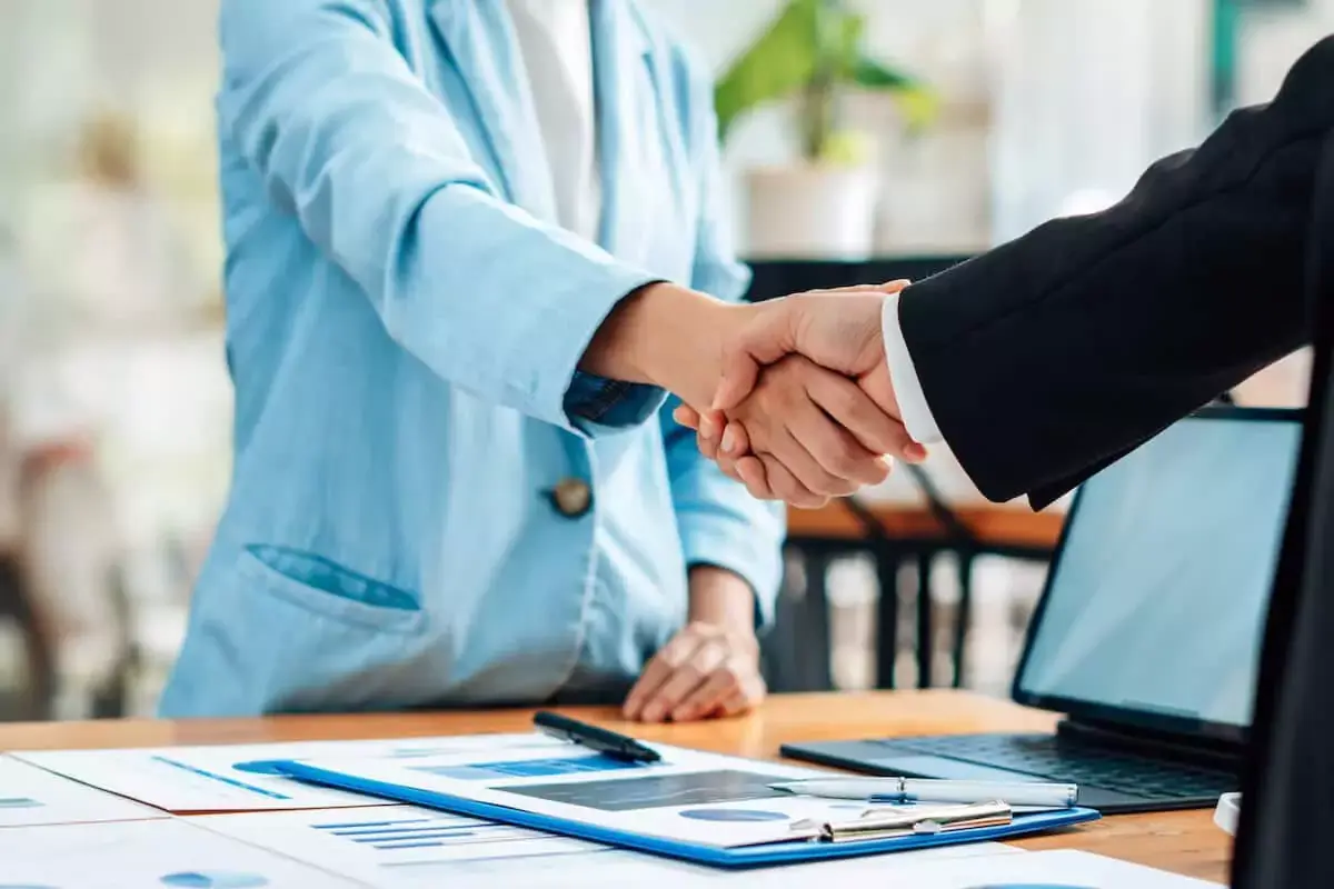 2-professionals-shaking-hands.jpeg