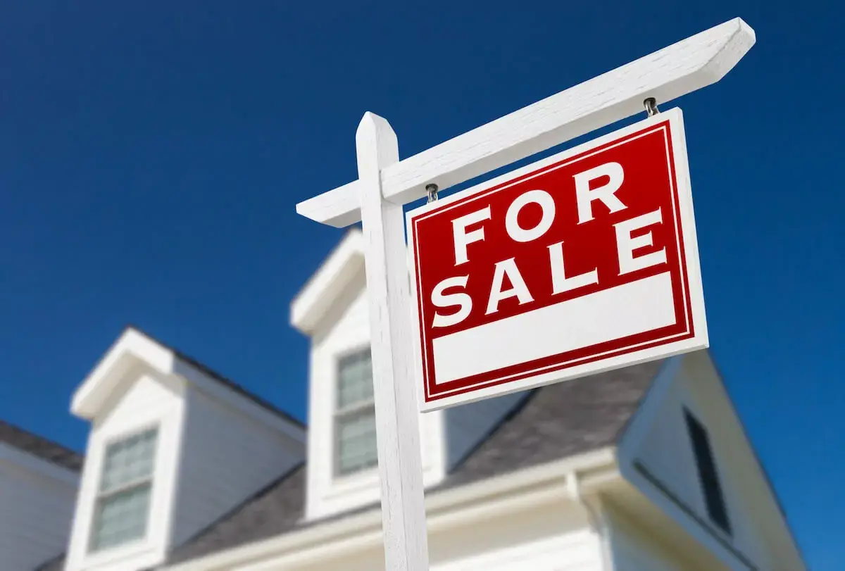 FOR-SALE-sign-in-front-of-a-house.jpeg