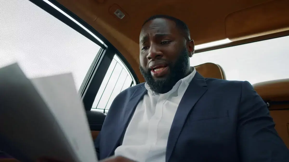 Man-looks-at-paperwork.jpg