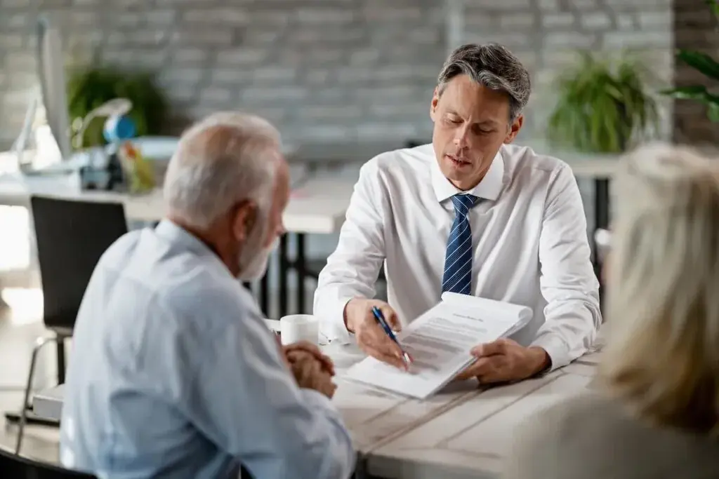 attorney-showing-a-contract-to-a-senior-man-1024x683.jpeg