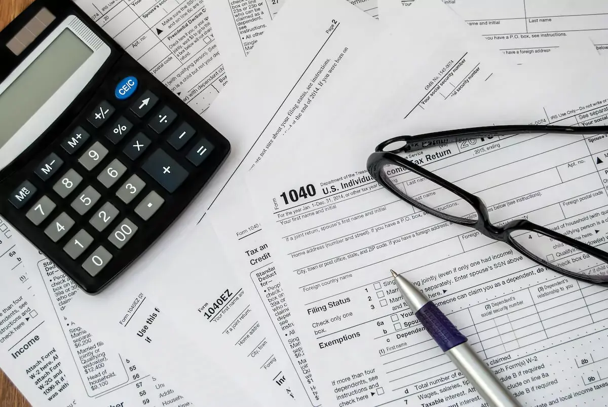 calculator-glasses-pen-and-tax-forms.jpeg
