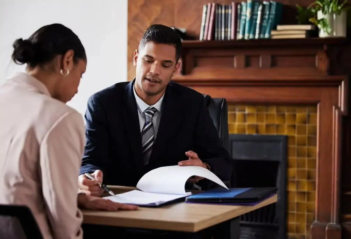client-talking-to-a-lawyer-about-her-documents.jpeg