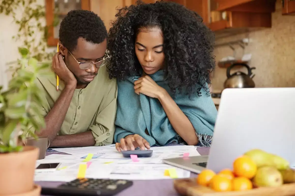 couple-budgeting-using-a-calculator.jpeg