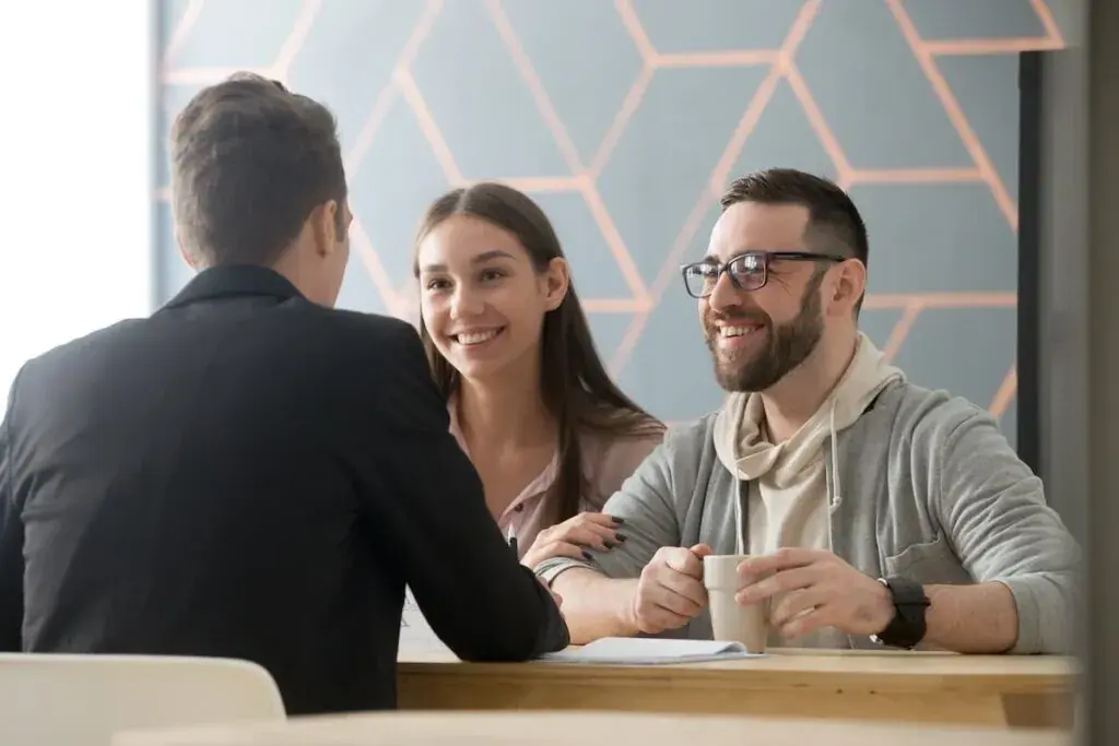 couple-happily-talking-to-their-lawyer-1024x683.jpeg