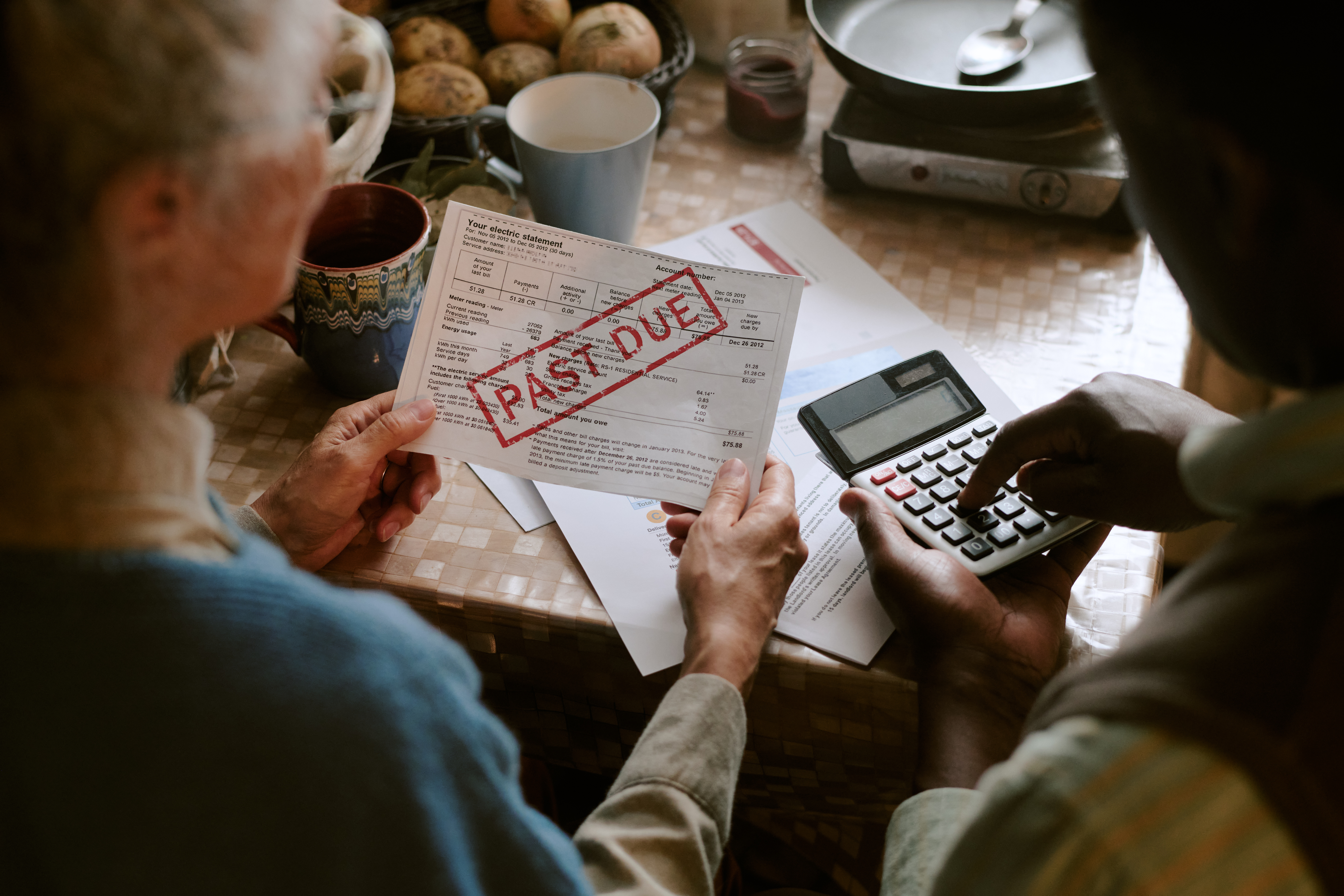 couple-reviewing-past-due-bill