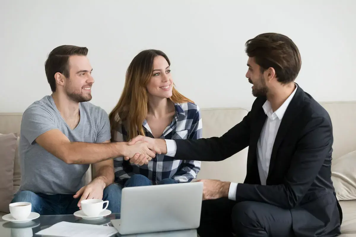 couple-shaking-hands-with-an-agent.jpeg