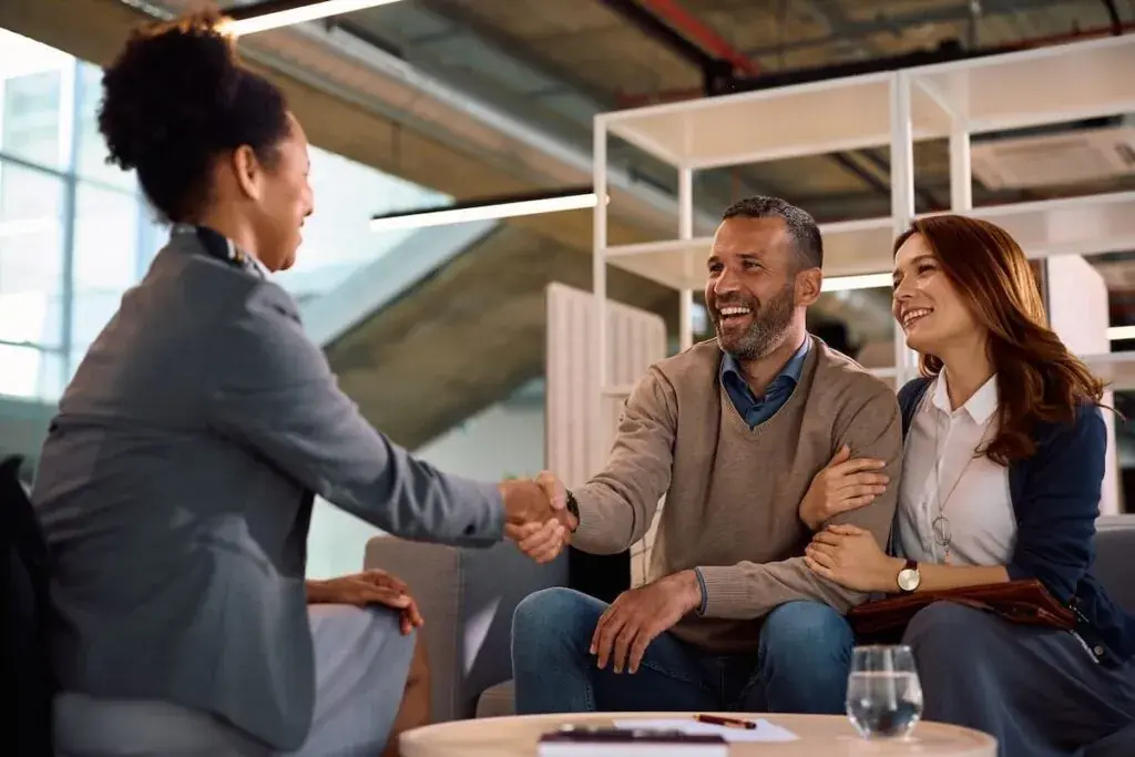 couple-shaking-hands-with-their-financial-advisor-1024x683.jpeg
