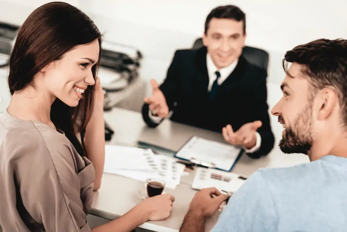 couple-talking-to-a-timeshare-marketer.jpeg