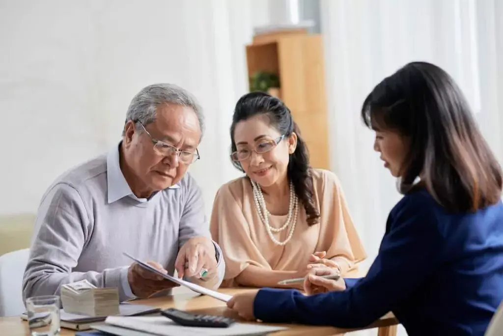 elderly-couple-discussing-a-document-with-an-agent-1024x684.jpeg