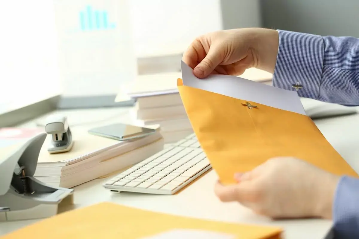 entrepreneur-holding-a-yellow-envelope.jpeg