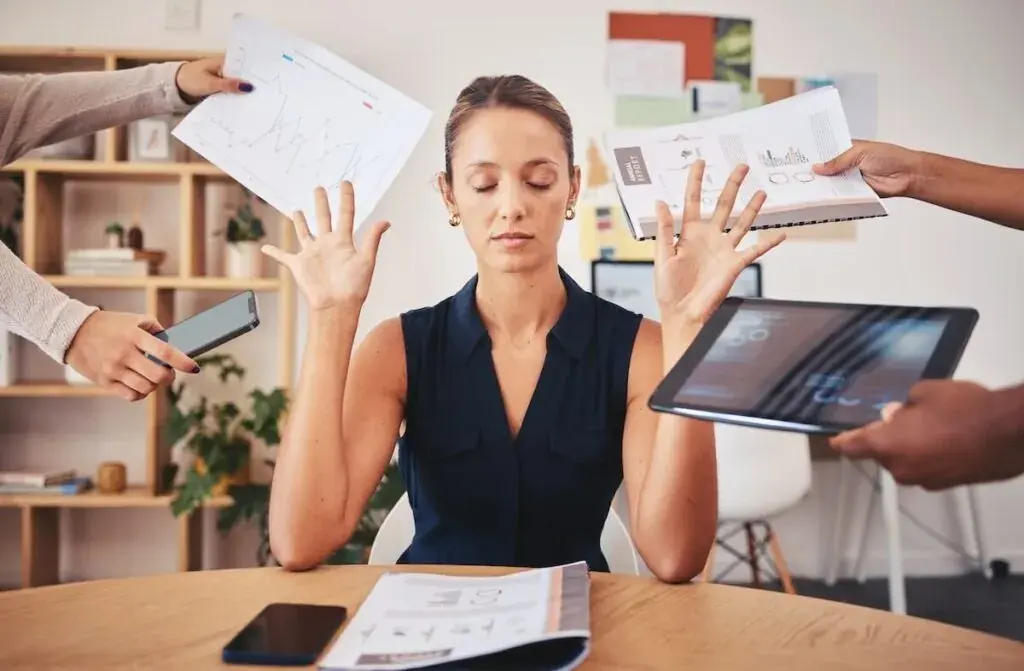 entrepreneur-holding-her-hands-up-with-her-eyes-closed-while-people-are-handing-her-stuff-1024x671.jpeg