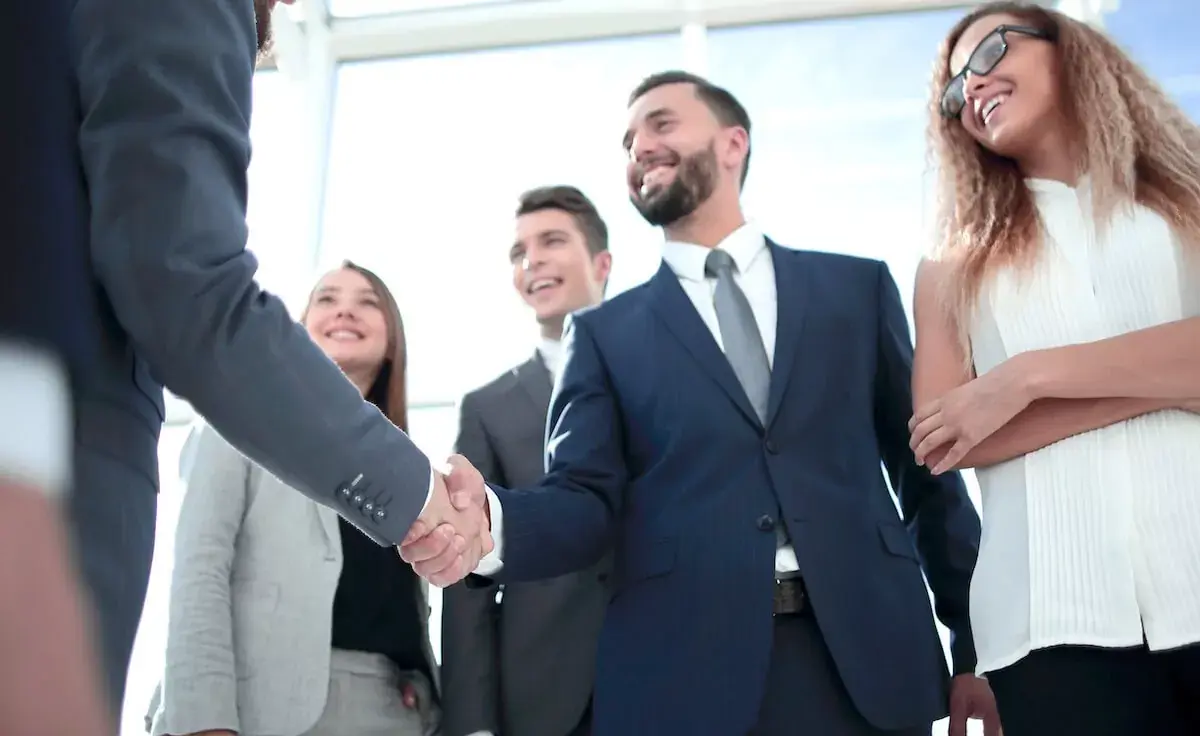 entrepreneur-shaking-hands-with-a-business-partner.jpeg