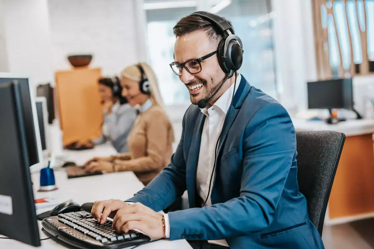 happy-customer-support-agent-on-a-call.jpeg
