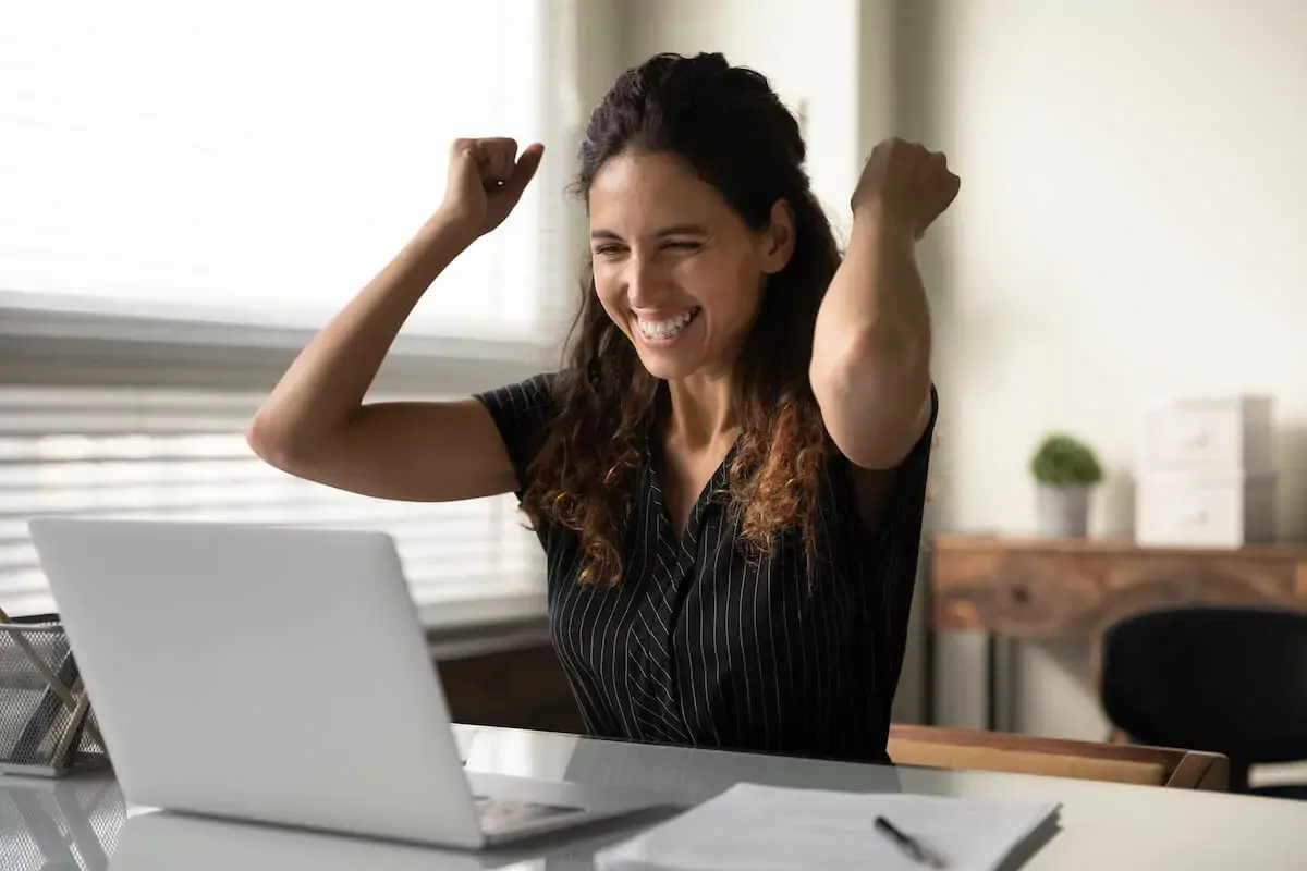 happy-woman-looking-at-a-laptop.jpeg