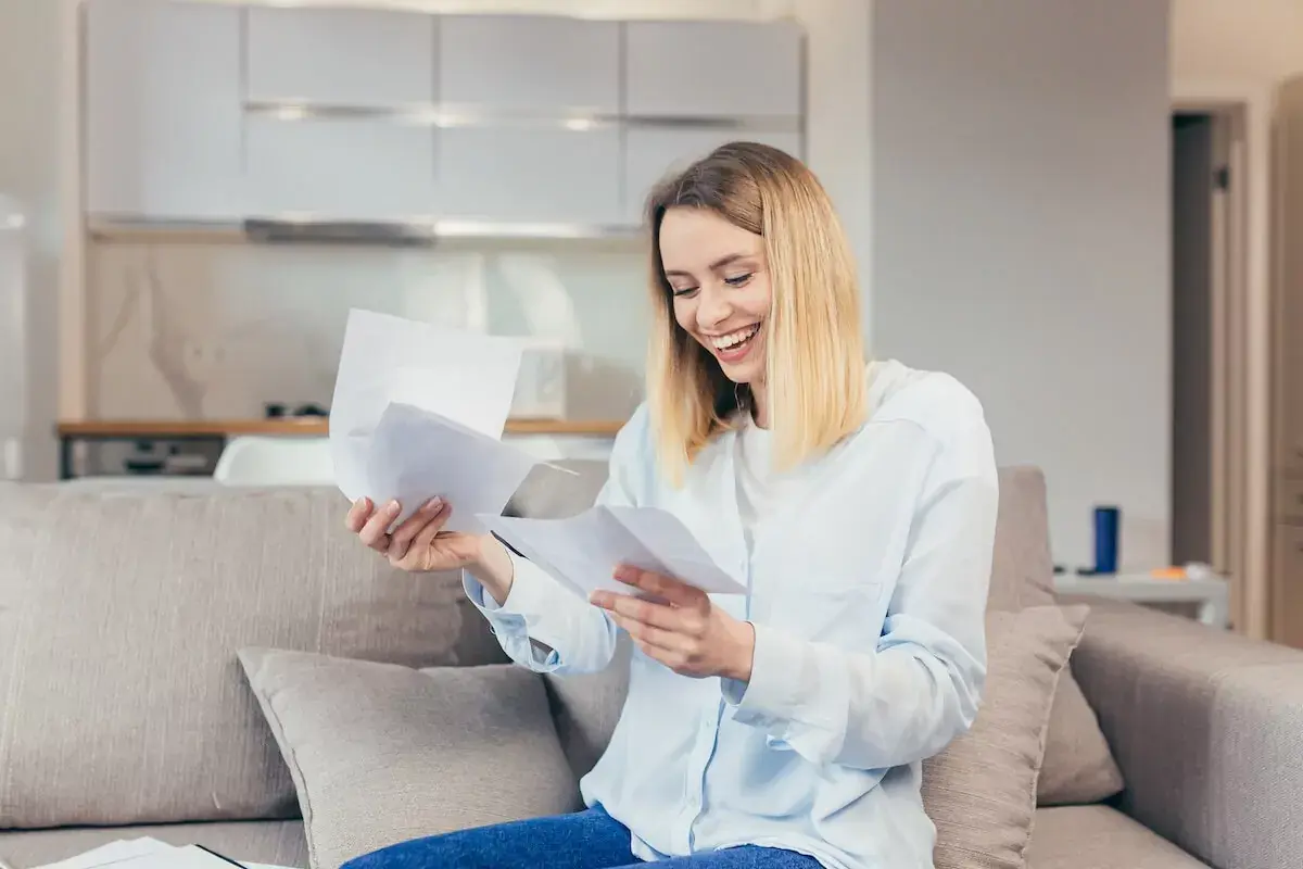 happy-woman-reading-some-files.jpeg