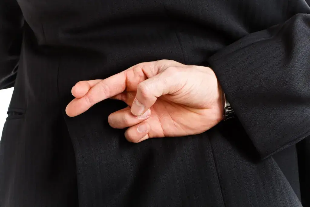 lawyer-crossing-his-fingers-1024x683.jpeg
