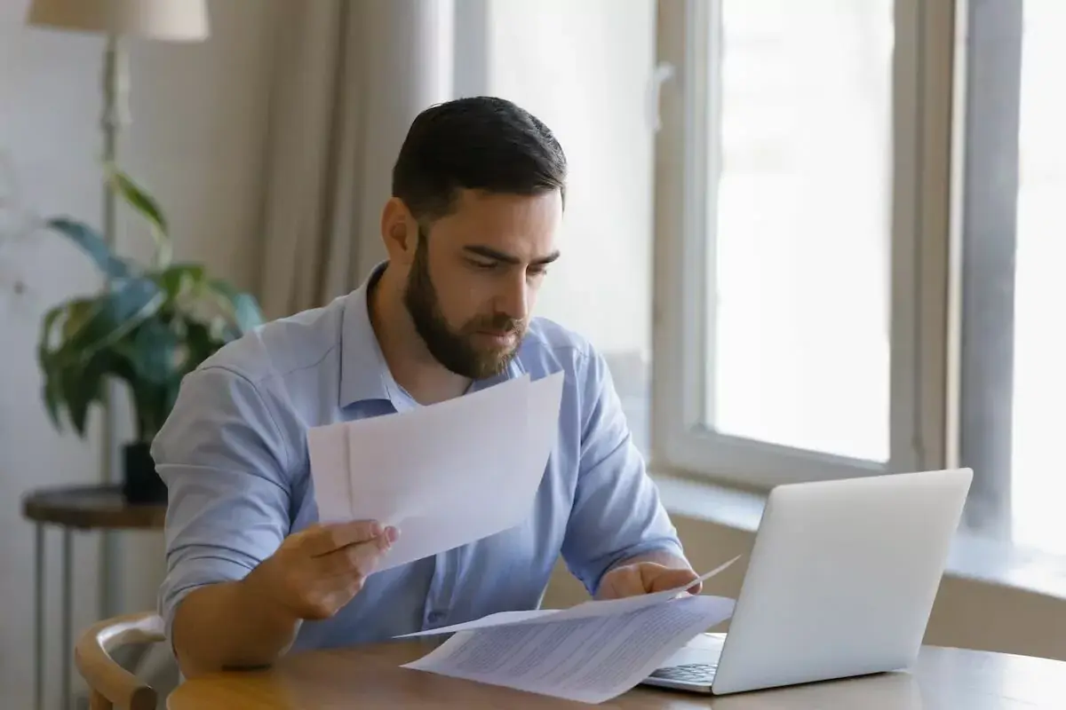 man-reading-some-documents.jpeg