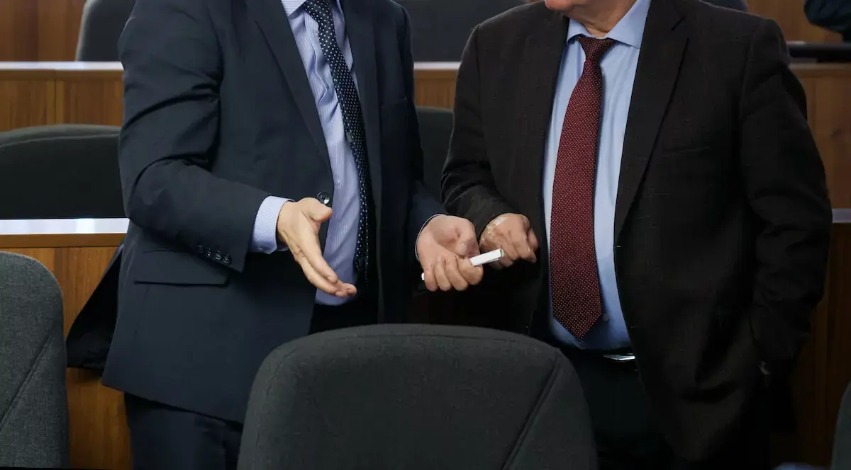 men-in-suits-talking-to-each-other.jpeg