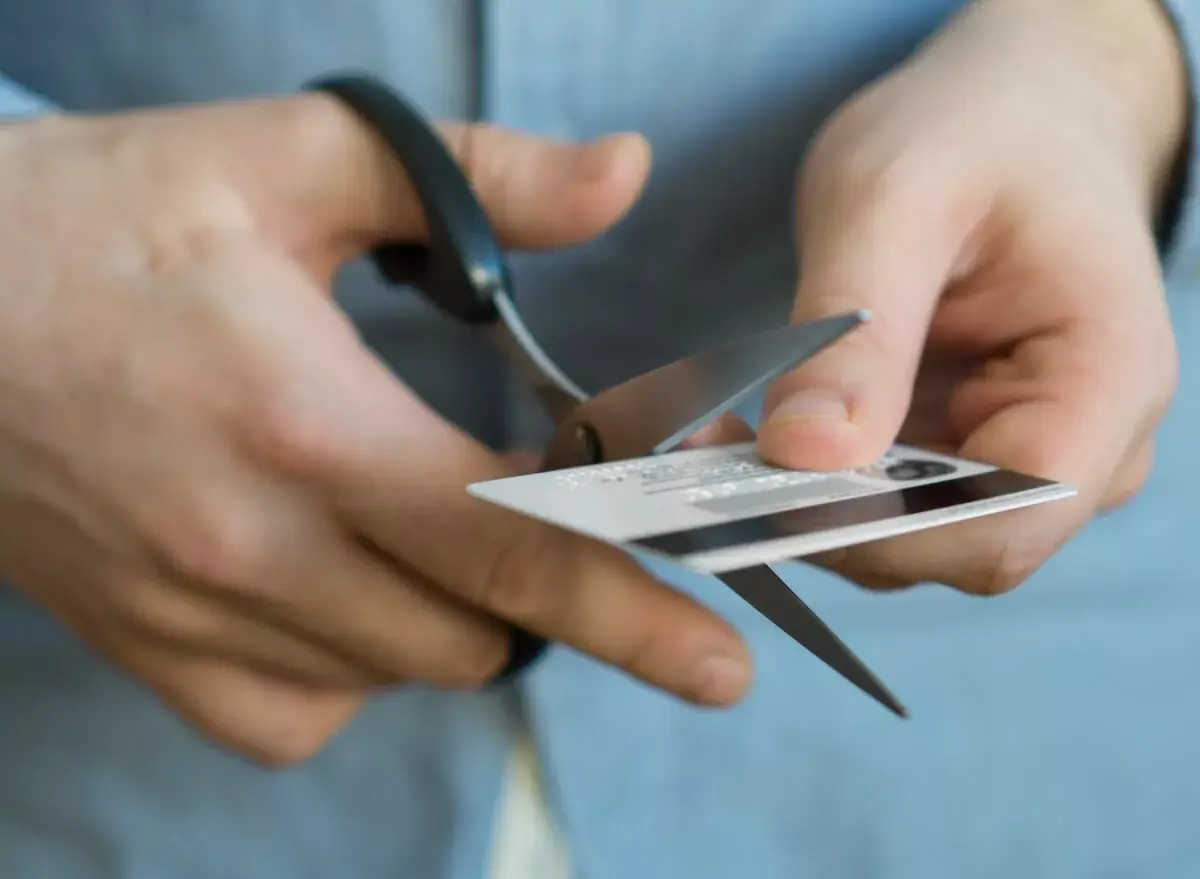 person-cutting-a-credit-card-using-a-pair-of-scissors.jpeg