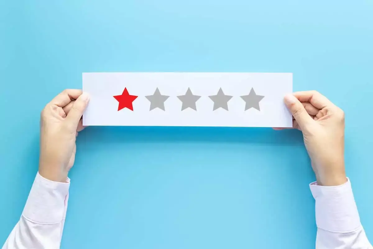person-holding-a-paper-with-one-out-of-five-stars.jpeg