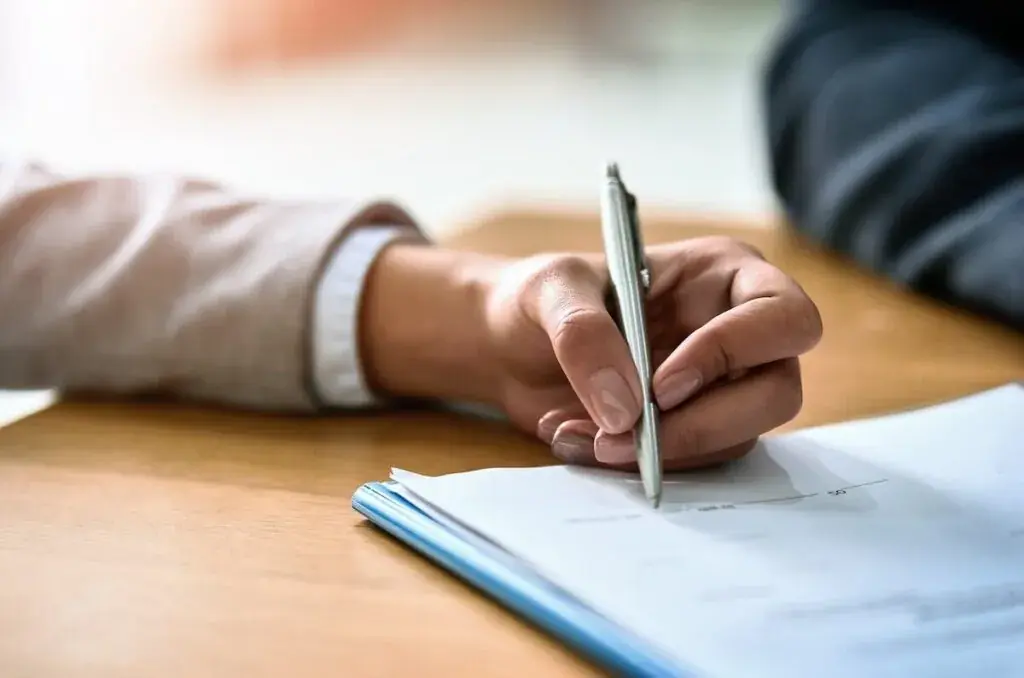 person-signing-a-contract-1024x678.jpeg