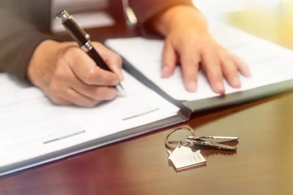 person-signing-a-document-1024x683.jpeg