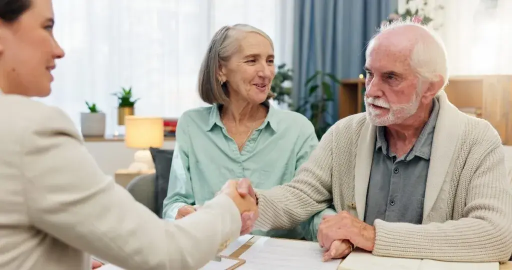 senior-couple-shaking-hands-with-a-real-estate-agent-1024x540.jpeg
