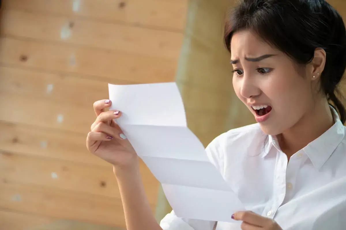shocked-woman-reading-a-document.jpeg