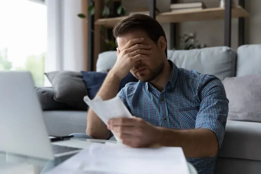 stressed-man-checking-his-bills-1024x683.jpeg