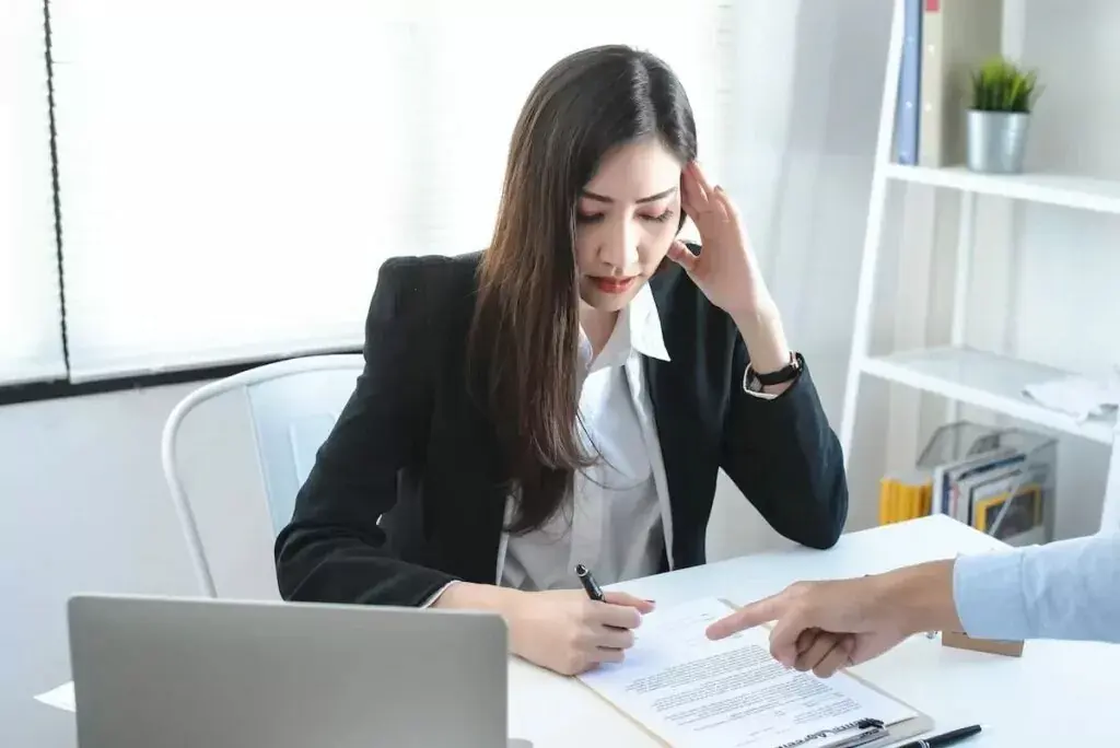 stressed-woman-signing-a-document-1024x684.jpeg