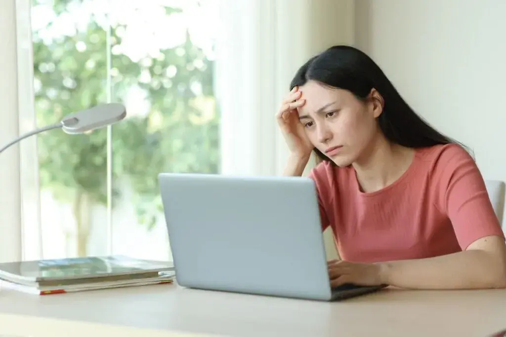stressed-woman-using-a-laptop-1024x683.jpeg