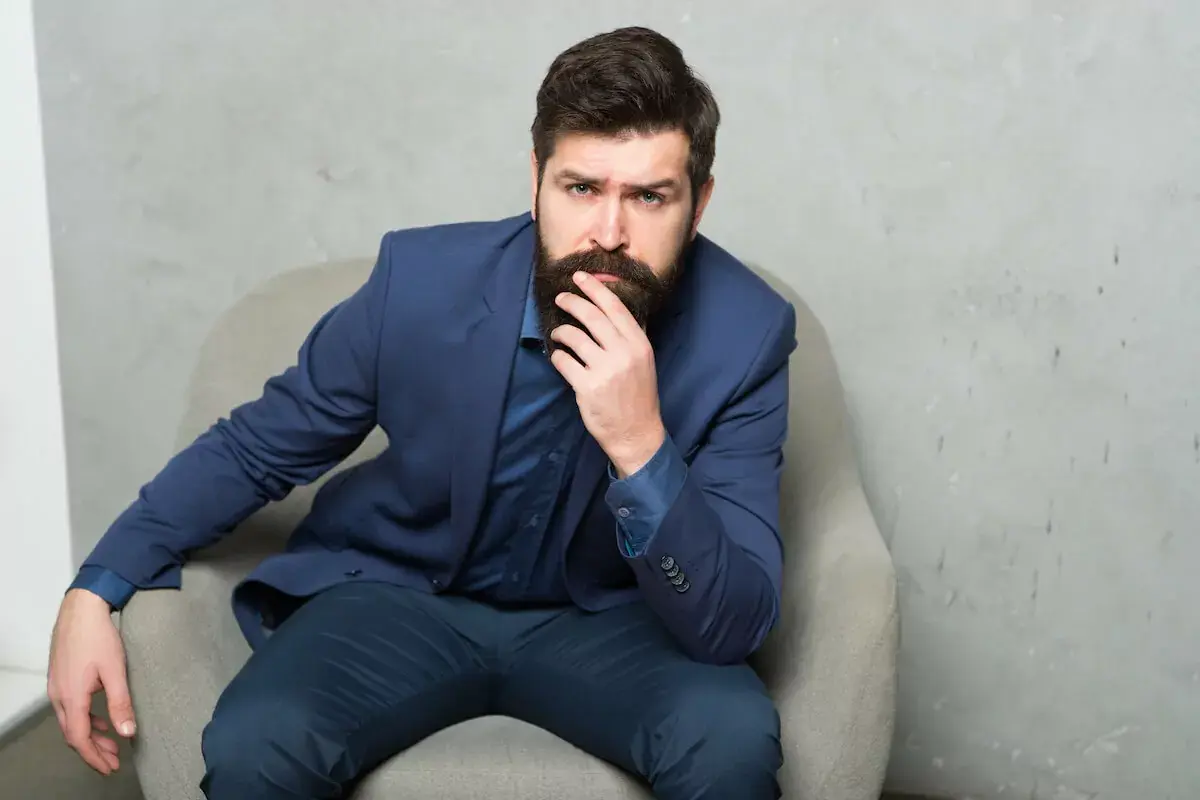 thinking-man-touching-his-beard.jpeg