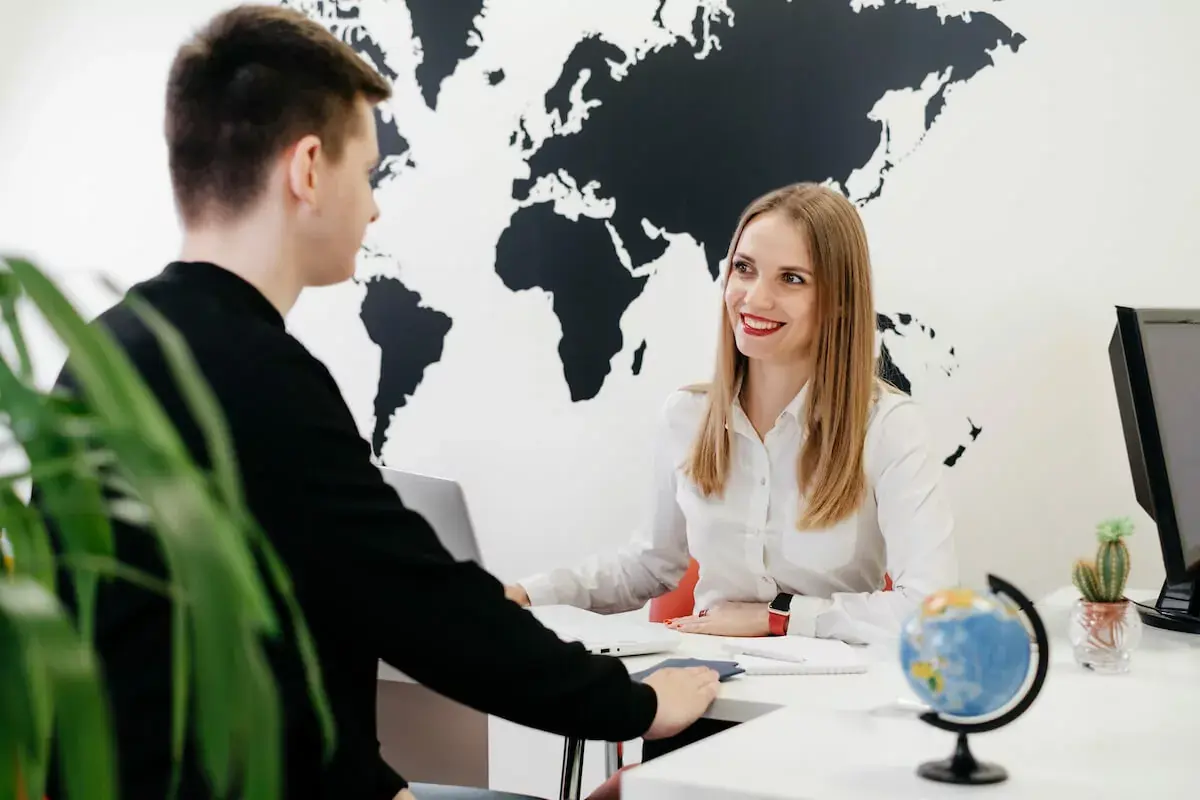 travel-agent-talking-to-a-client.jpeg