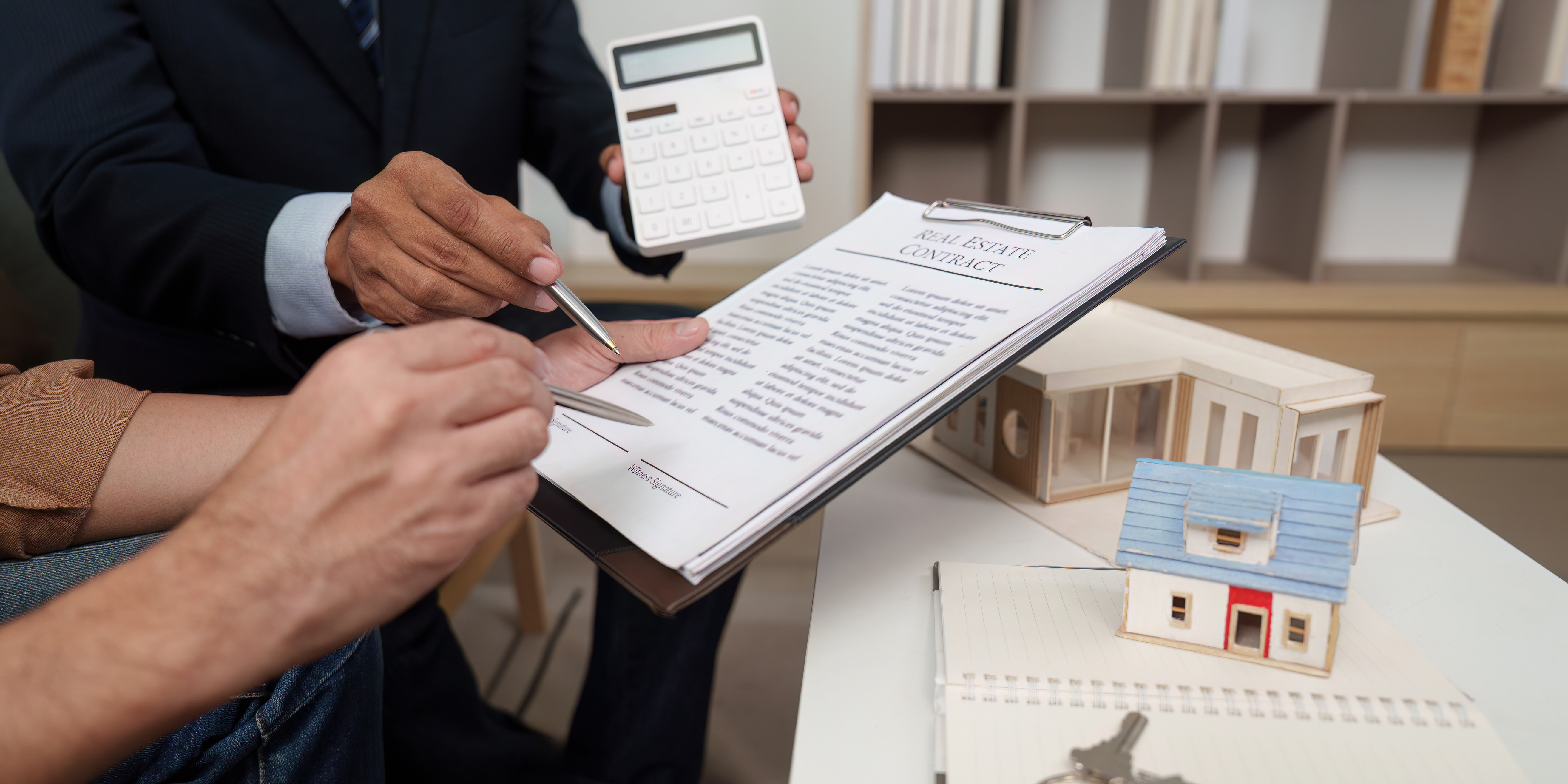 two-people- reviewing-contract