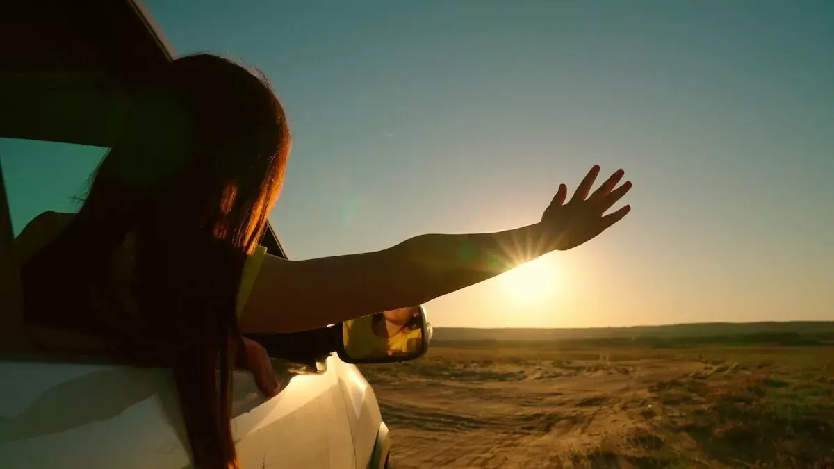 woman-with-her-hand-out-a-car-window.jpeg