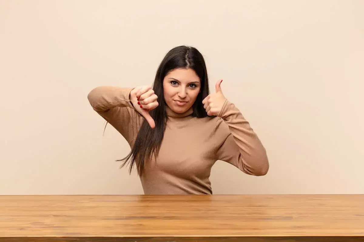 woman-with-her-thumbs-up-and-down.jpeg