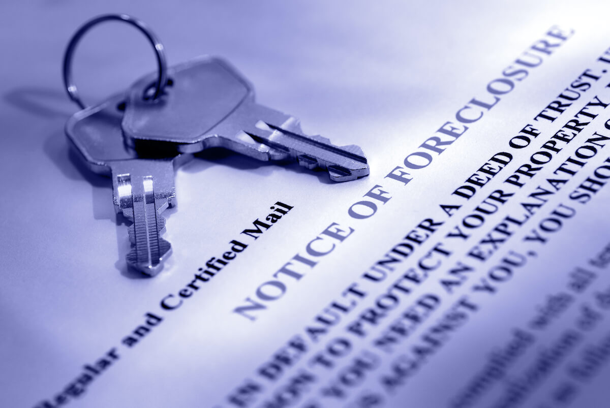 keys on top of a foreclosure notice