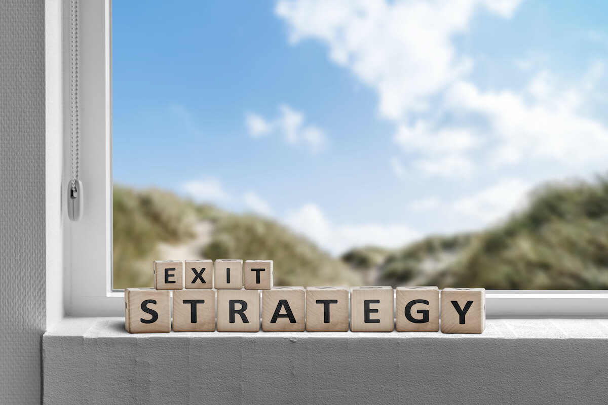 Timeshare Freedom Group: Exit Strategy spelled out using wooden blocks