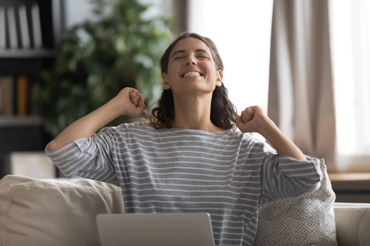 Excited woman in her living room