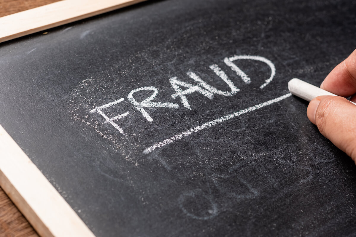How to prove fraud: FRAUD written on a blackboard