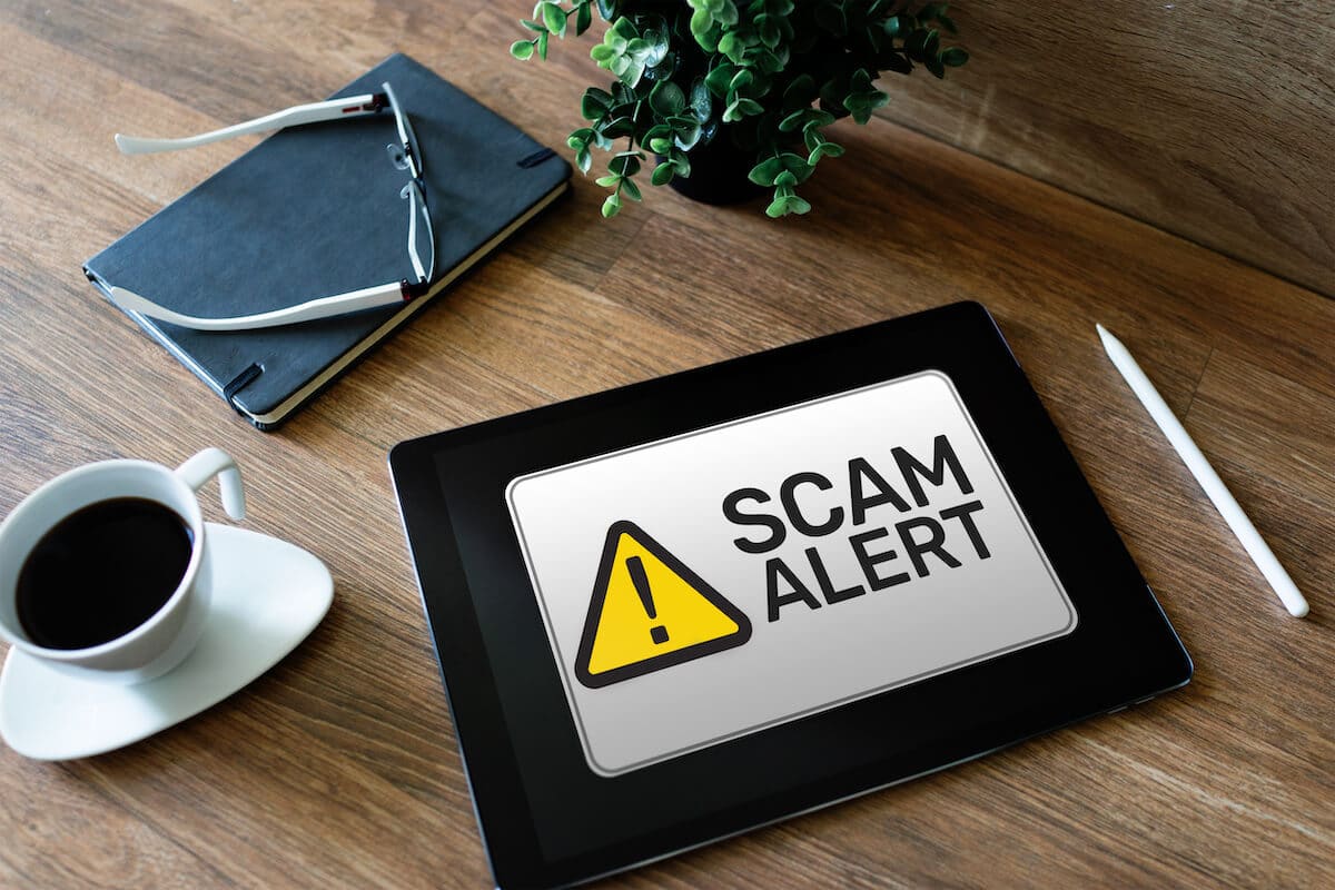 Timeshare resale scams: SCAM ALERT on a tablet