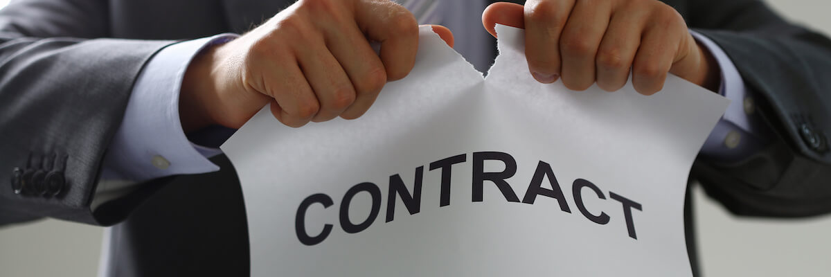 Timeshare exchange companies: person tearing up a contract