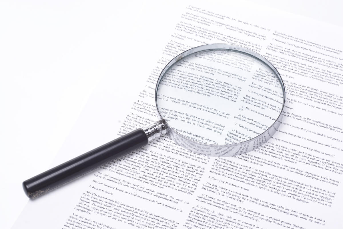 Magnifying glass on a contract