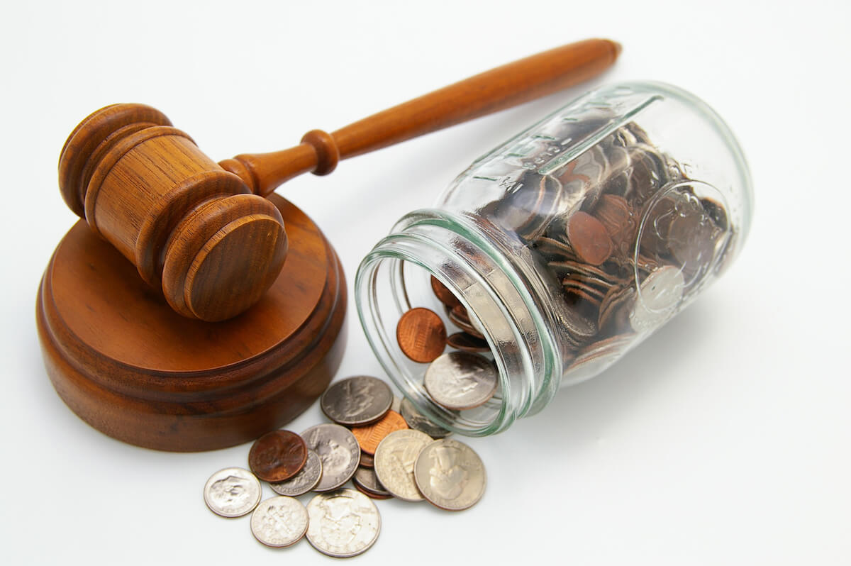 Timeshare cancellation attorney: jar of coins beside a hammer and gavel