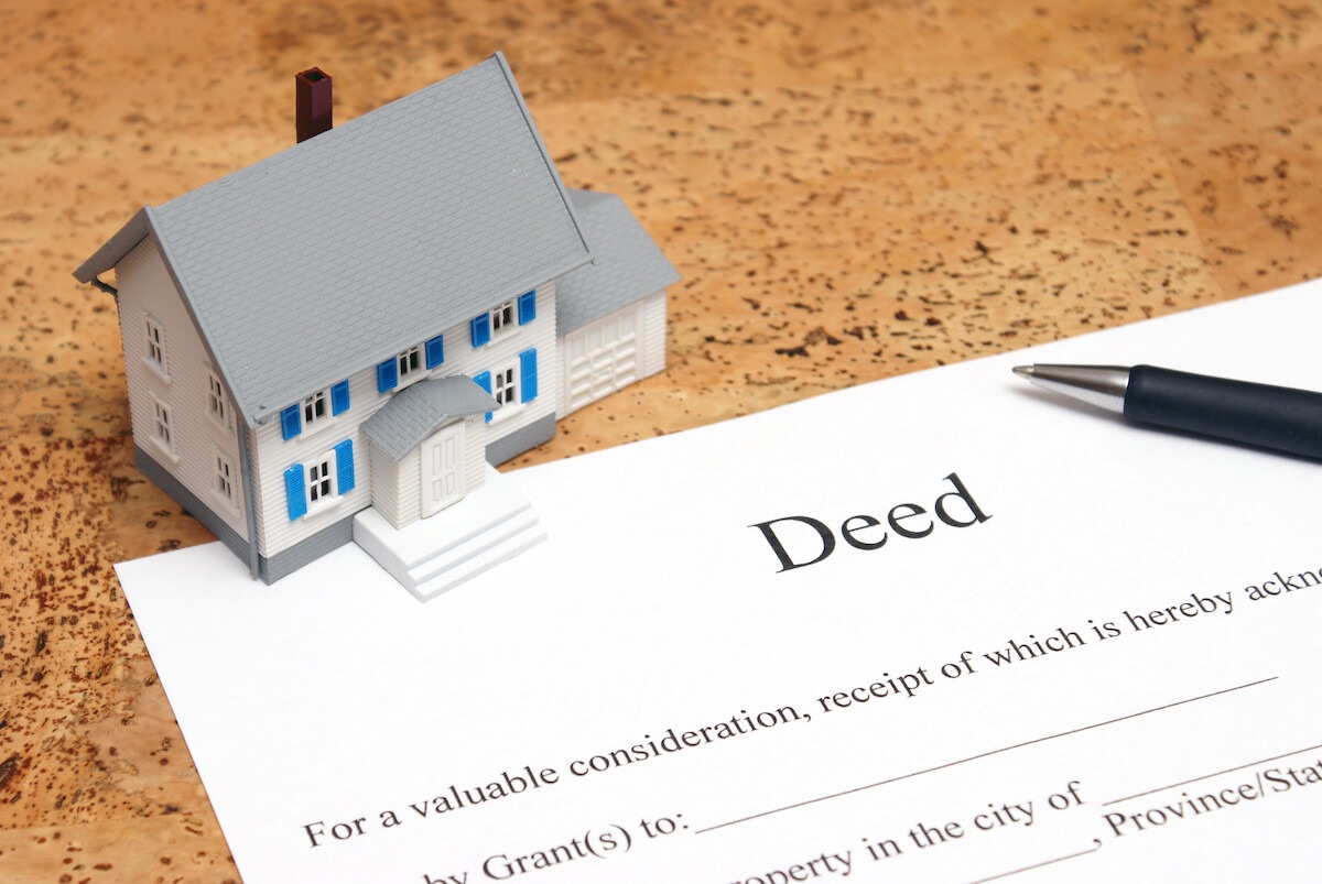 Timeshare contract: toy house and a Deed contract
