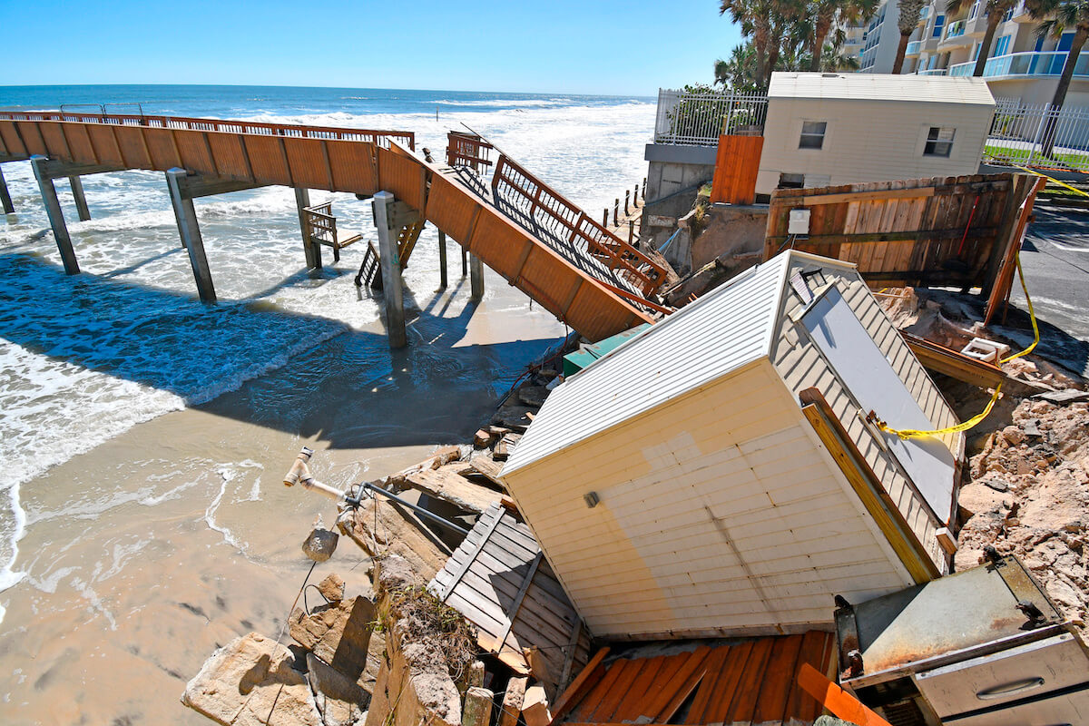 Will Hurricane Ian affect my timeshare maintenance fees: damaged bridge and houses in Daytona Beach Volusia County, Florida