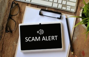 Timeshare resale scams Mexico: SCAM ALERT on a tablet screen
