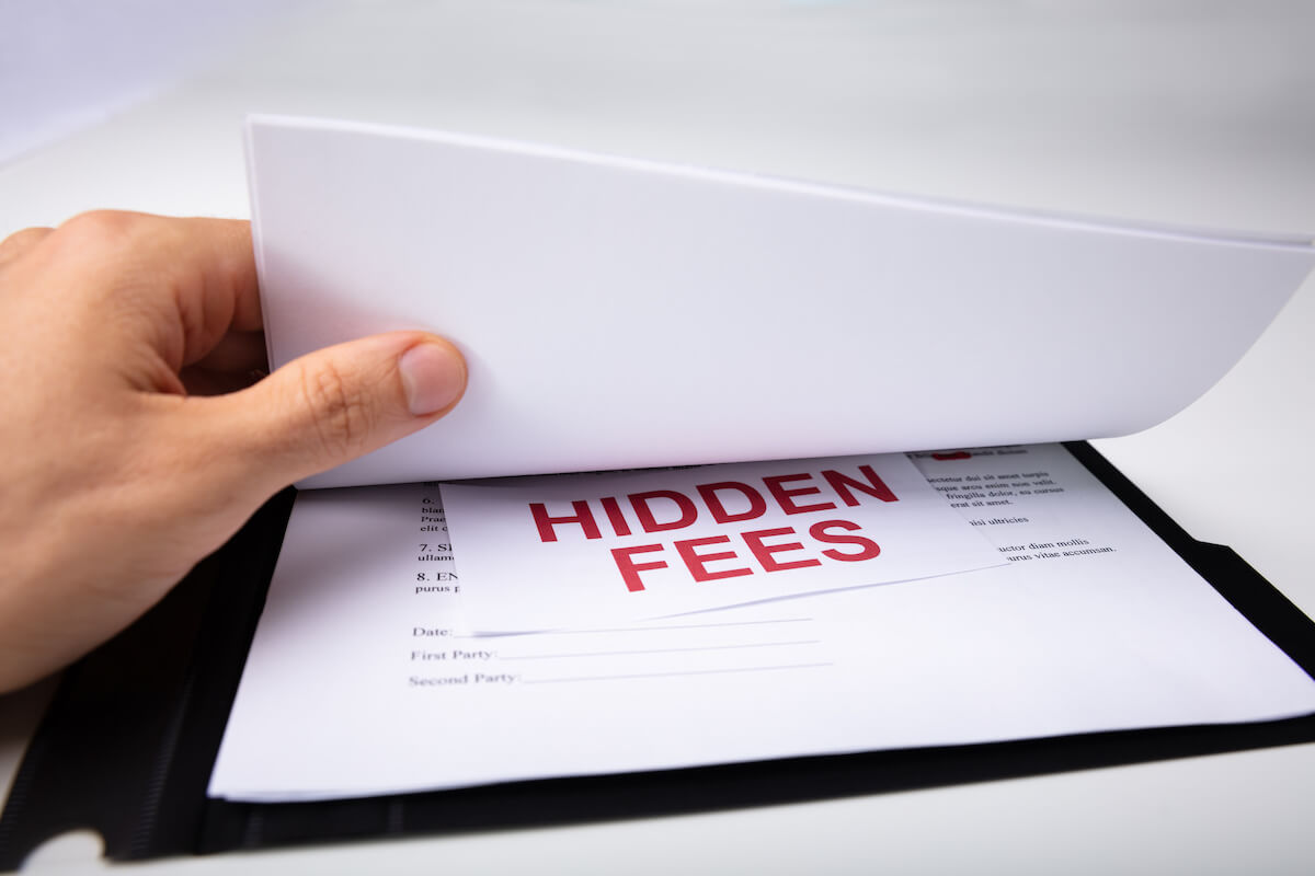 HIDDEN FEES printed on a paper