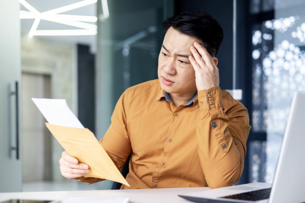 Bluegreen Vacations: stressed entrepreneur reading a letter