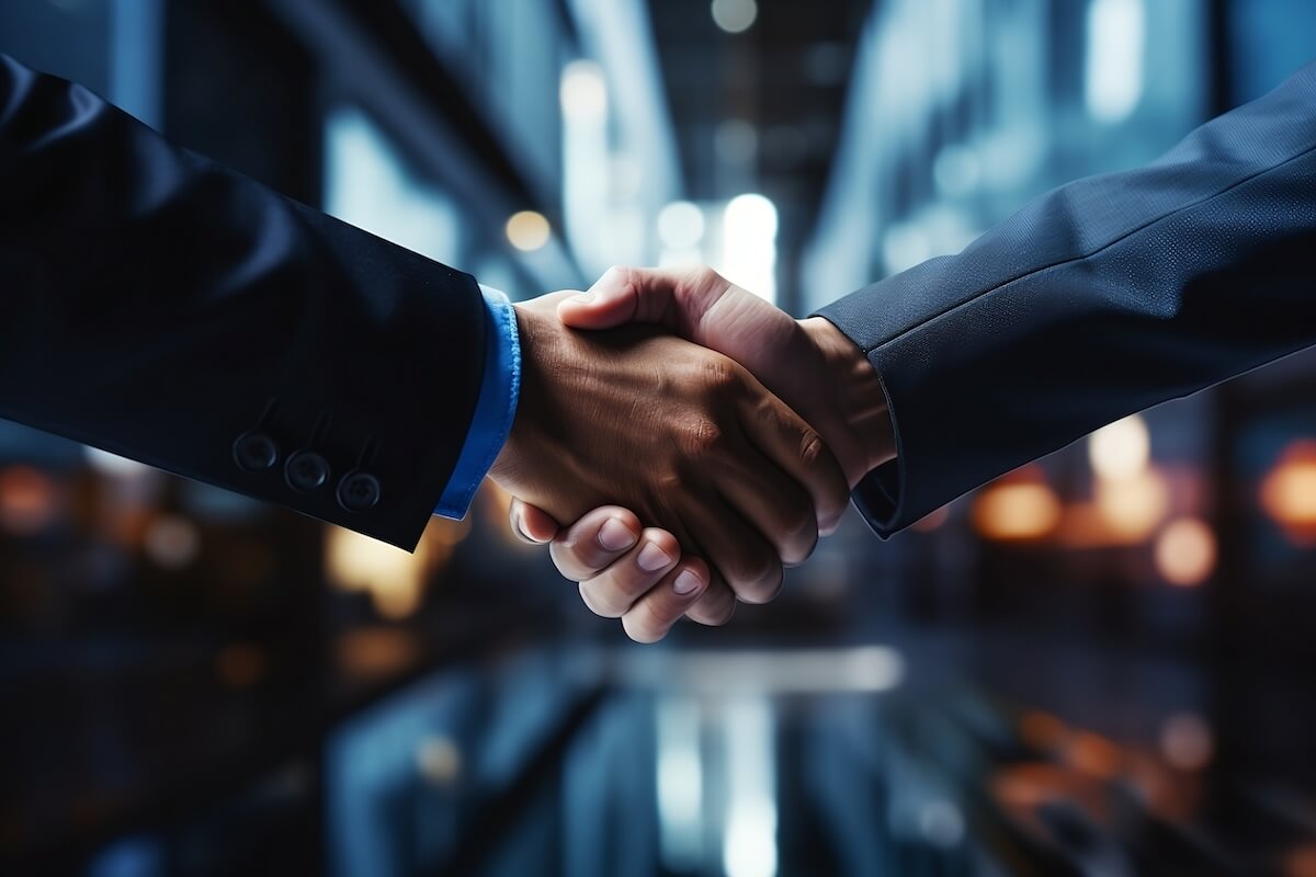 Bluegreen acquisition: A closeup of two businessmen shaking hands